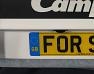 Sticky pad to attach number plate