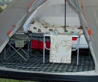 Teepee living room with table, chairs and carpet